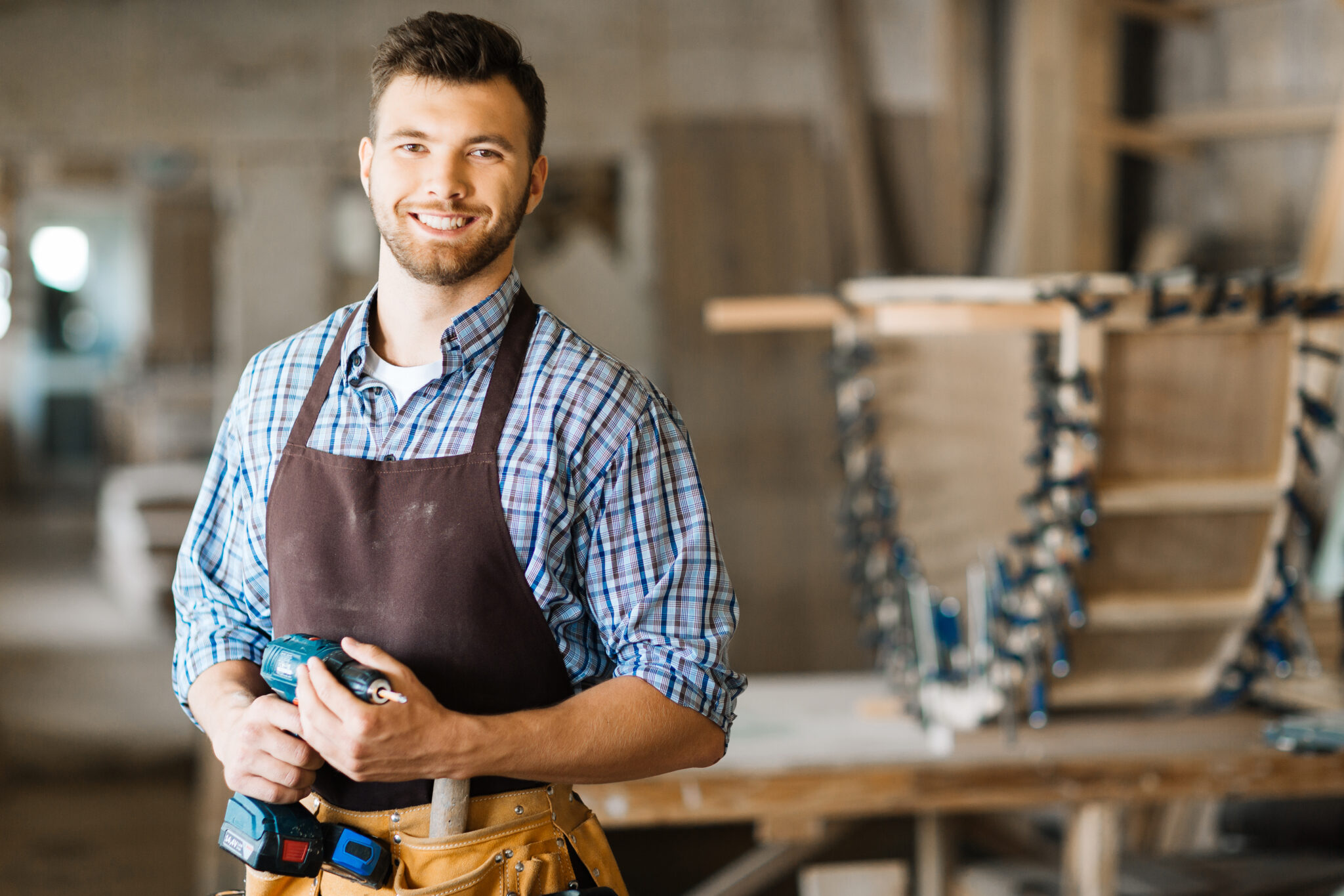 Smiling craftsman proud of his American-made work
