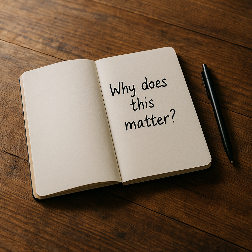 Open notebook with the handwritten question 'Why does this matter?' on a clean wooden desk